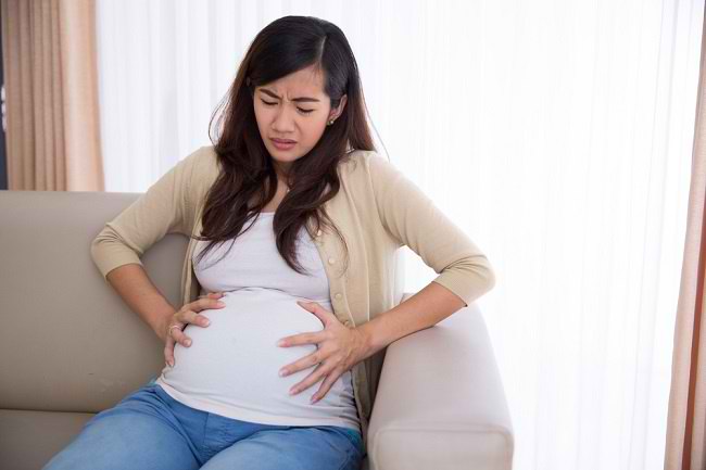 Recunoașteți diversele cauze ale unui stomac strâns în timpul sarcinii